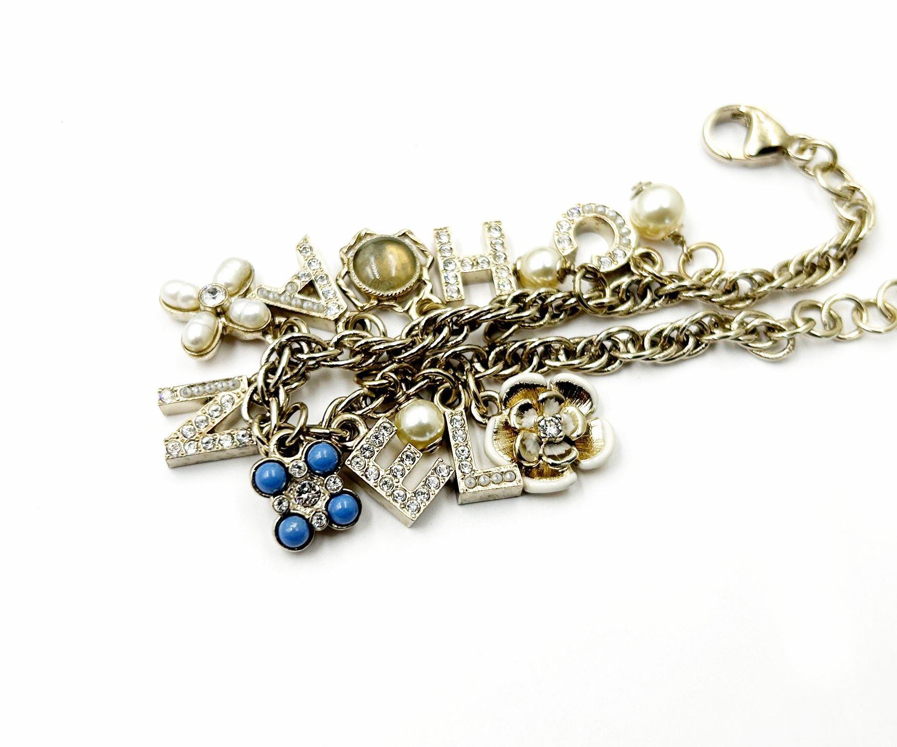 Chanel Gold Letter Clover Flower Motif Bracelet In Excellent Condition For Sale In Pasadena, CA