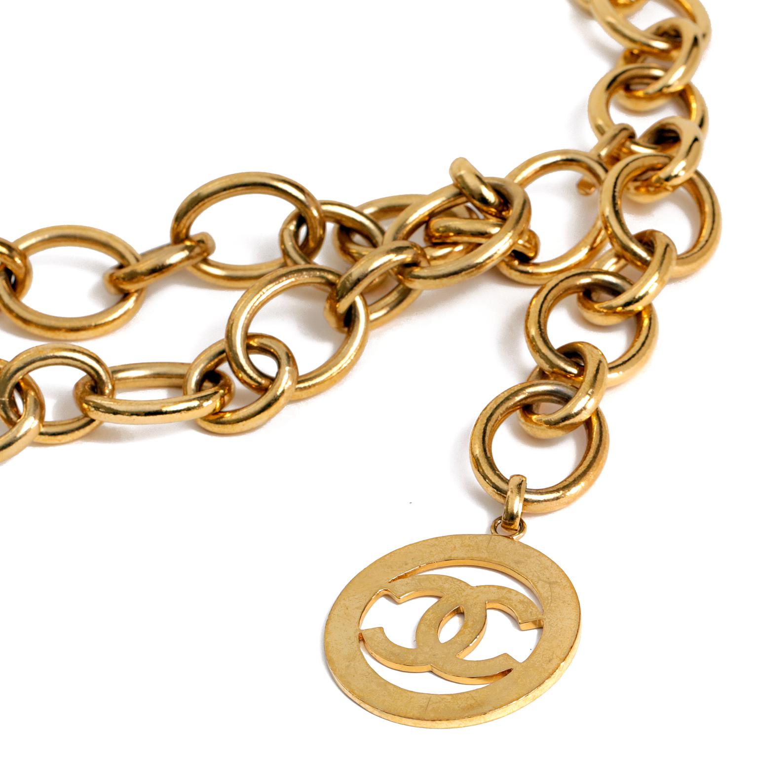  Chanel Gold Chain Belt -excellent condition  
Large gold linked double belt with adjustable length.  A large flat gold disc with interlocking CC dangles from the end.
