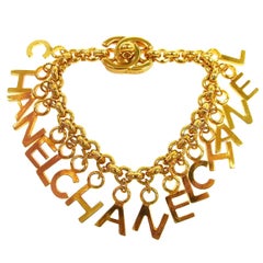 CHANEL Gold Logo 
CHANEL
 Chain Charm Dangle Evening Bracelet in Box