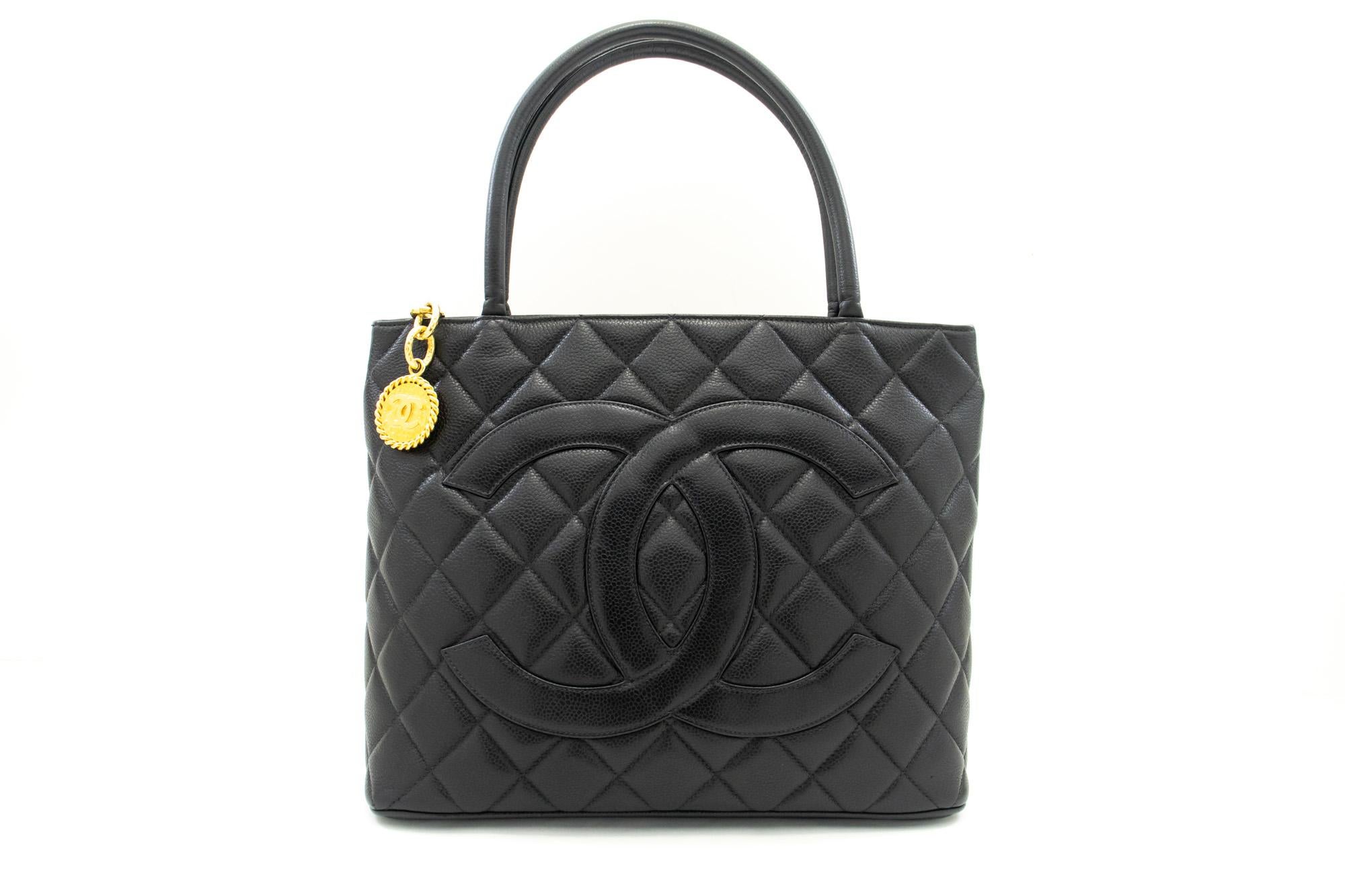 An authentic CHANEL Gold Medallion Caviar Shoulder Bag Grand Shopping Tote. The color is Black. The outside material is Leather. The pattern is Solid. This item is Vintage / Classic. The year of manufacture would be 1996-1997.
Conditions &