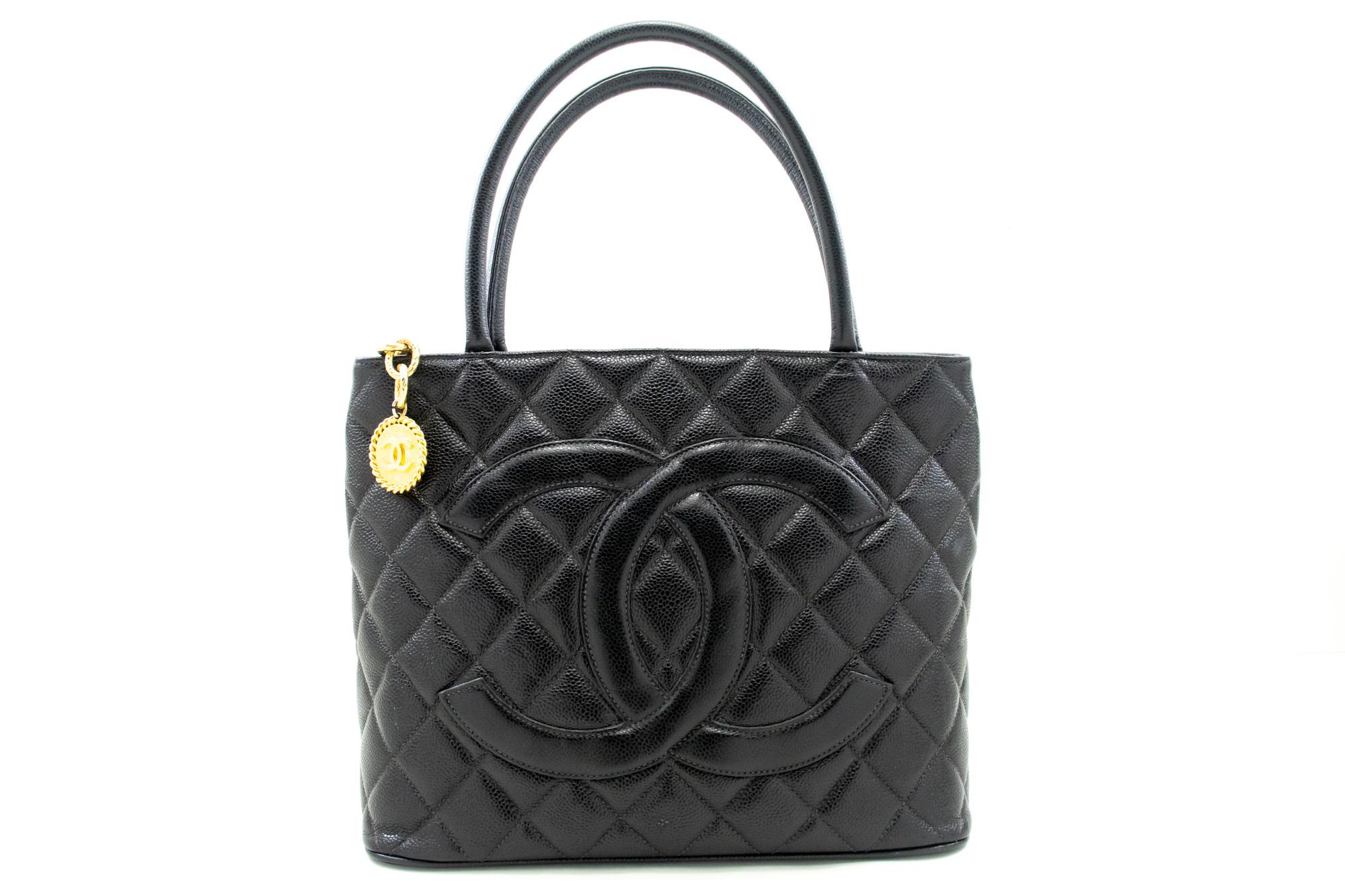 An authentic CHANEL Gold Medallion Caviar Shoulder Bag Grand Shopping Tote. The color is Black. The outside material is Leather. The pattern is Solid. This item is Vintage / Classic. The year of manufacture would be 1997-1999.
Conditions &