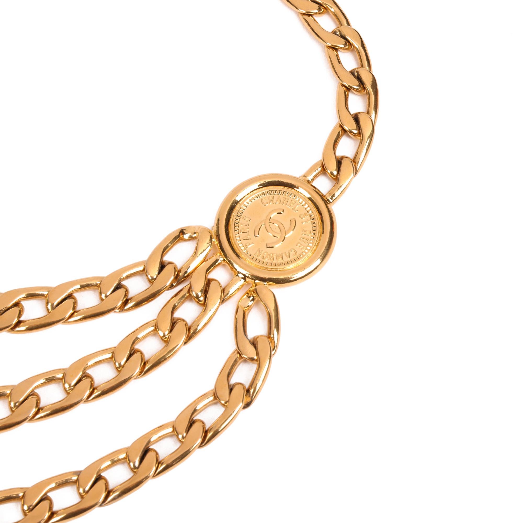 Chanel GOLD MEDALLION COIN VINTAGE TRIPLE CHAIN BELT

CONDITION NOTES
The hardware is in good condition with light signs of use. The Hardware shows slight signs of tarnishing.
Overall this item is in good pre-owned condition. Please note the