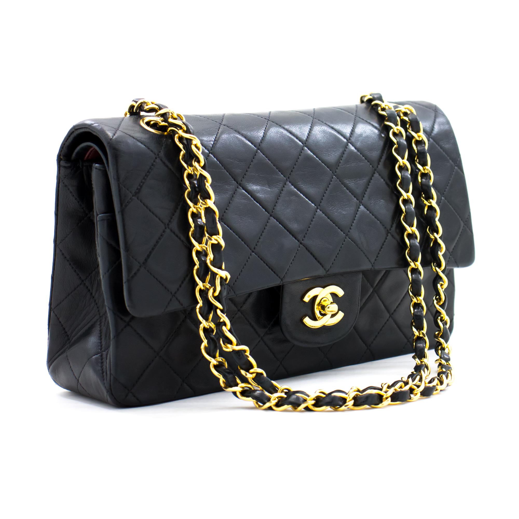 This iconic Chanel 10 inch bag is crafted from quilted black lambskin and features a double flap. On the front flap there is the classic CC logo twist lock, and on the second flap a stud closure with one slip-in pocket. The inside lining is covered