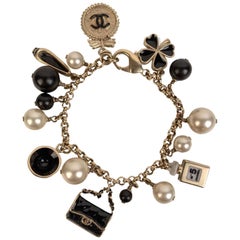 Chanel Gold Metal Faux Pearl and Iconic Charm Bracelet