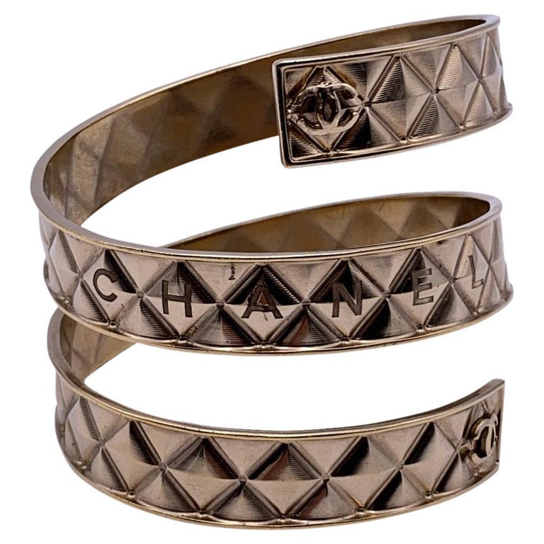 Chanel Gold Metal Quilted Spiral Cuff Bangle Bracelet For Sale at 1stDibs