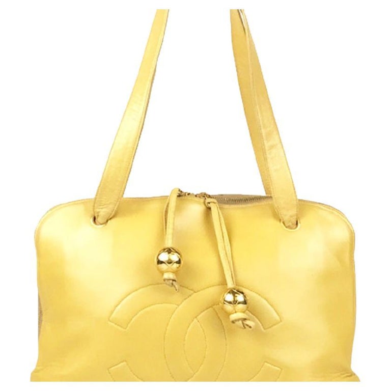 Chanel Gold Metallic Lambskin Leather CC Logo Rounded Handbag at