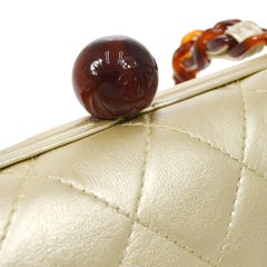 CHANEL Gold Metallic Lambskin Quilted Leather Tortoise Kisslock  Shoulder Bag