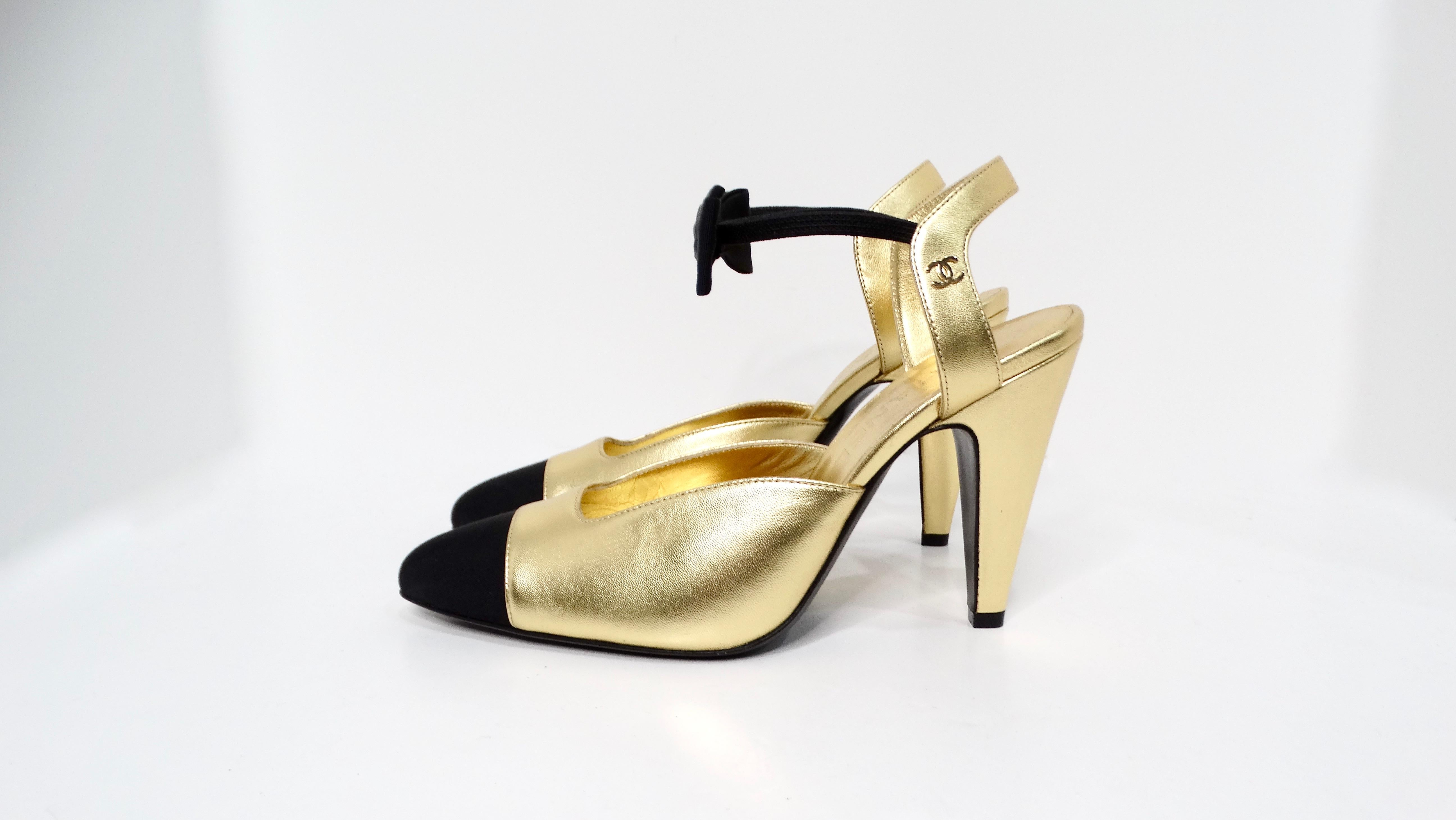 Introducing the Chanel Gold Metallic Laminated Lambskin Grosgrain Slingback Pumps with Bows, a stunning fusion of elegance and modern flair. These luxurious pumps feature a striking gold metallic finish on soft, laminated lambskin leather, ensuring