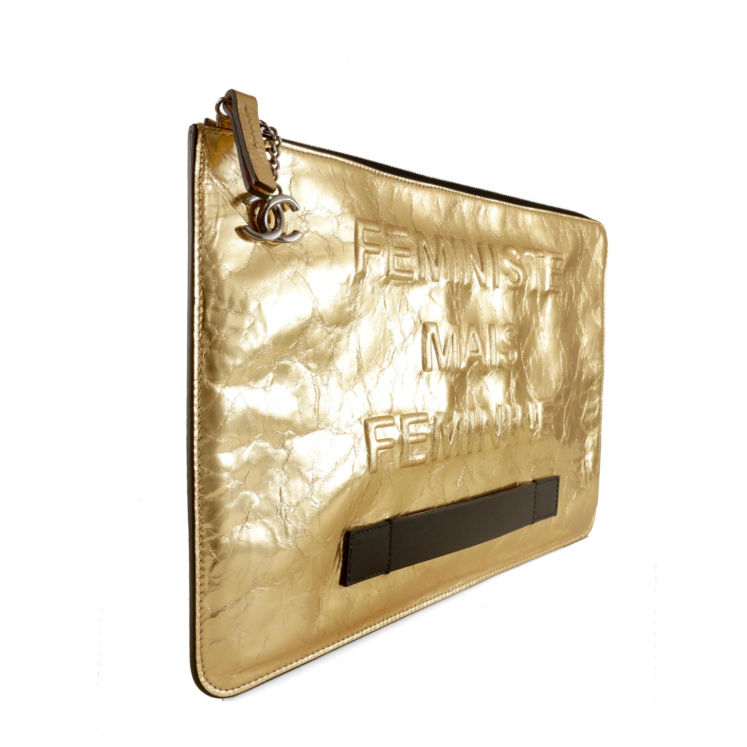 Chanel Gold Foil Feministe Mais Feminine Folio Clutch- pristine condition
From the Spring Summer 2015 collection, this spirited piece says, “I’m a feminist, but feminine.”
Extra large gold metallic leather clutch has an intentionally distressed foil