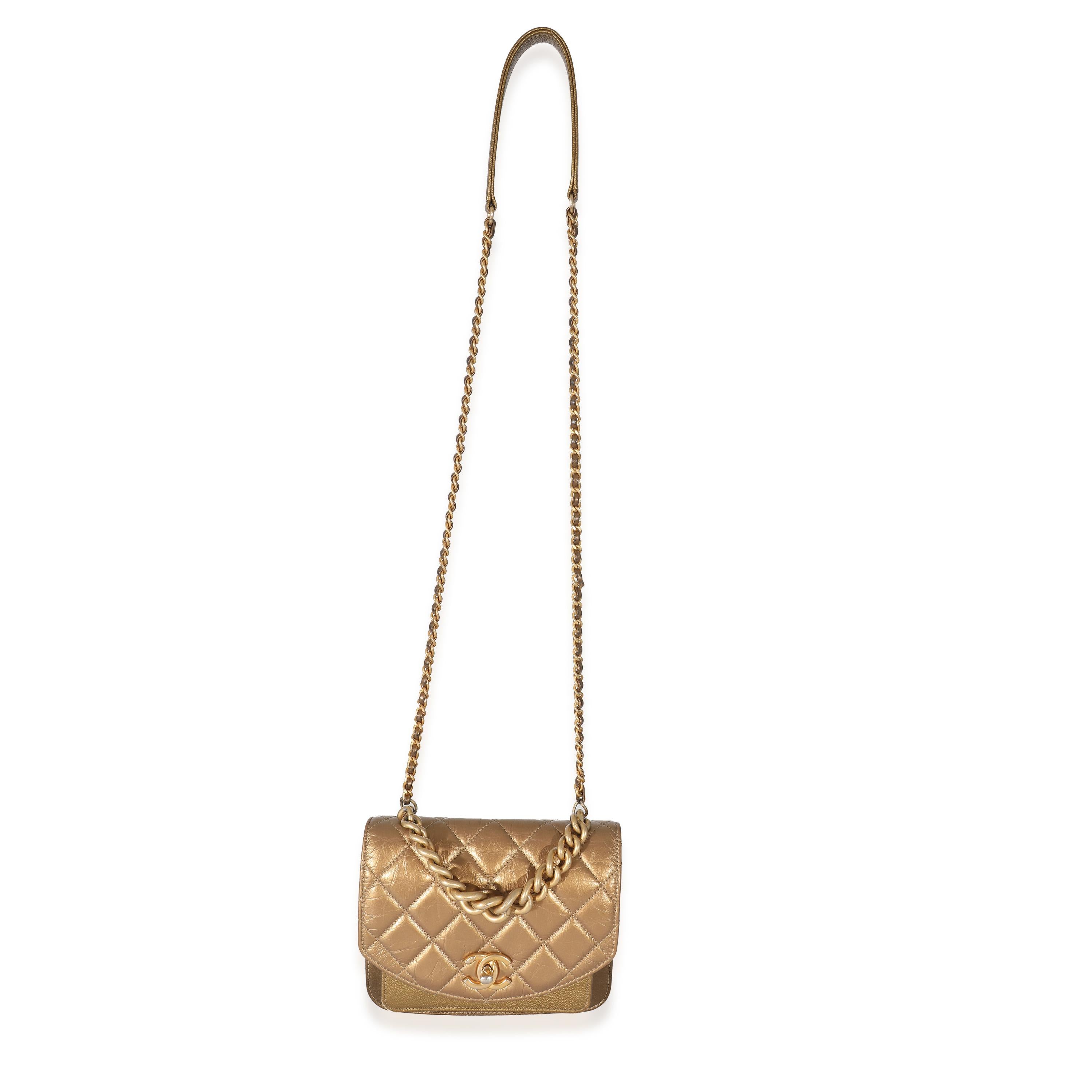 Listing Title: Chanel Gold Metallic Leather Mini Chain Handle Flap Bag
SKU: 134029
Condition: Pre-owned 
Handbag Condition: Very Good
Condition Comments: Item is in very good condition with minor signs of wear. Extensive scuffing, and discoloration
