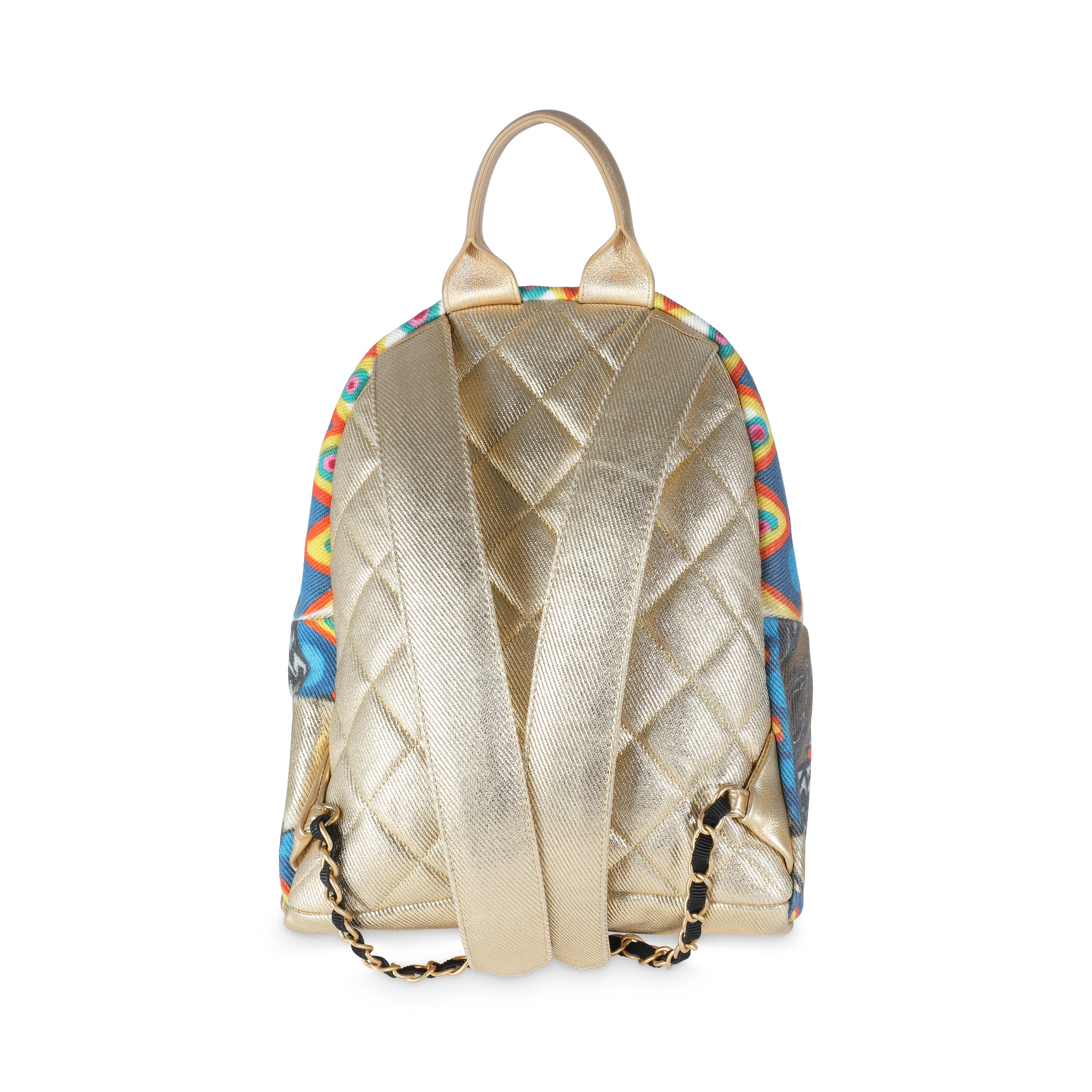 Listing Title: Chanel Gold Multicolor Graffiti Canvas Street Spirit Backpack
SKU: 140569
Condition: Pre-owned 
Handbag Condition: Excellent
Condition Comments: Item is in excellent condition and displays light signs of wear. Faint scratching along