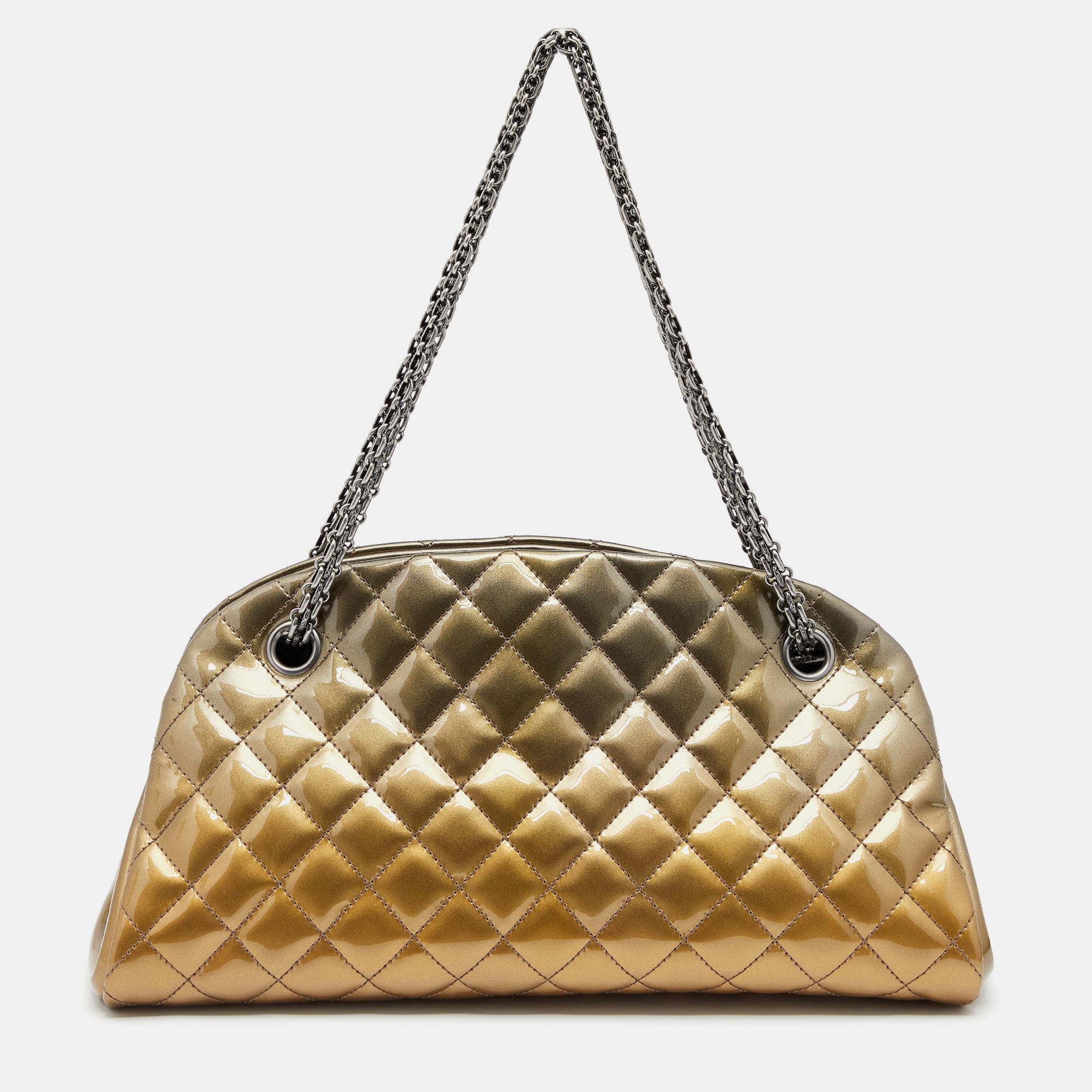 Spacious and lovely, this Just Mademoiselle Bowler bag is from Chanel. It comes crafted from gold ombre patent leather, covered in the signature diamond quilt, and enhanced with dark ruthenium-tone hardware. It is equipped with chain handles and a
