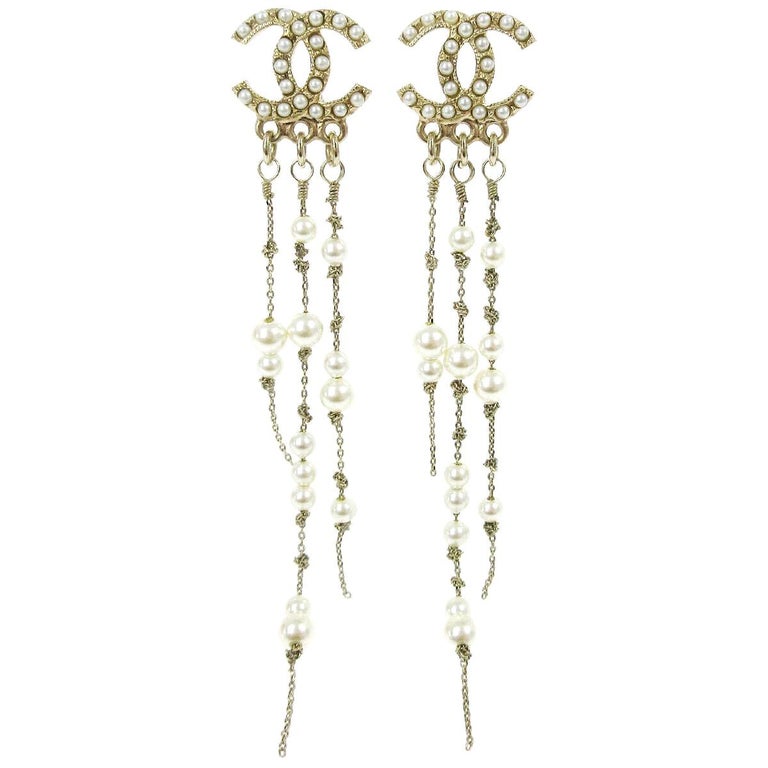 CHANEL 26S DOUBLE C LOGO BLACK ENAMEL BOW DANGLE EARRINGS WITH CHAIN CHARMS IN GOLD METAL 629178