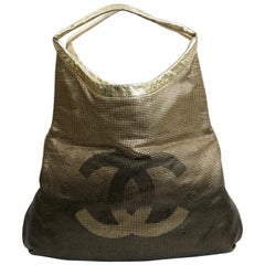 CHANEL Gold Perforated Leather Bag