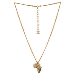 CHANEL gold-plated 23A DAKAR AFRICA PENDANT Necklace