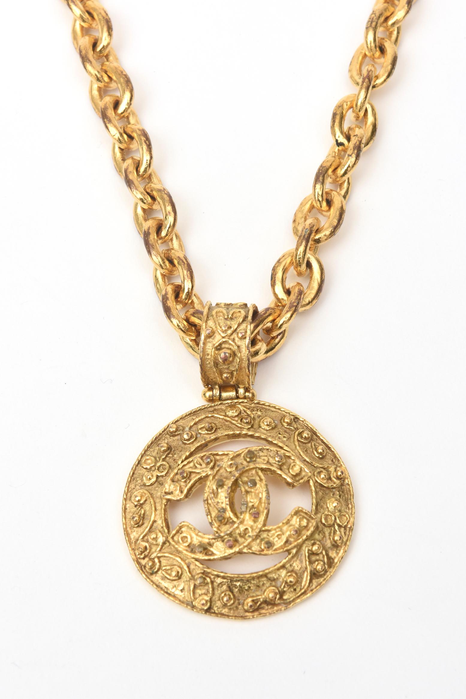 This authentic fabulous Chanel chunky gold plated hammered medallion chain necklace has the interlocking CC's. It is from the 1984. It is hallmarked Chanel 