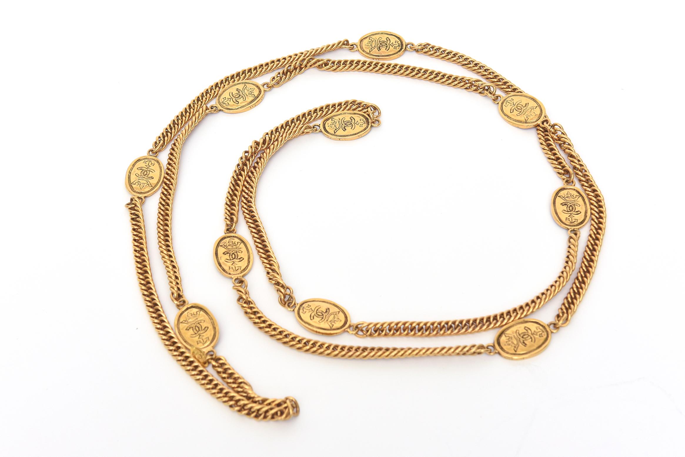 This unusual and special vintage Chanel gold chain medallion necklace was designed by Victorie de Castellane in 1987 for Chanel. It is a chain wrap necklace that has medallions interspersed that is 70 Inches long and can do a 3 time wrap on your