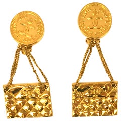 Chanel Gold-Plated clip on dangle earrings with “Chanel 51 Rue Cambon Paris”