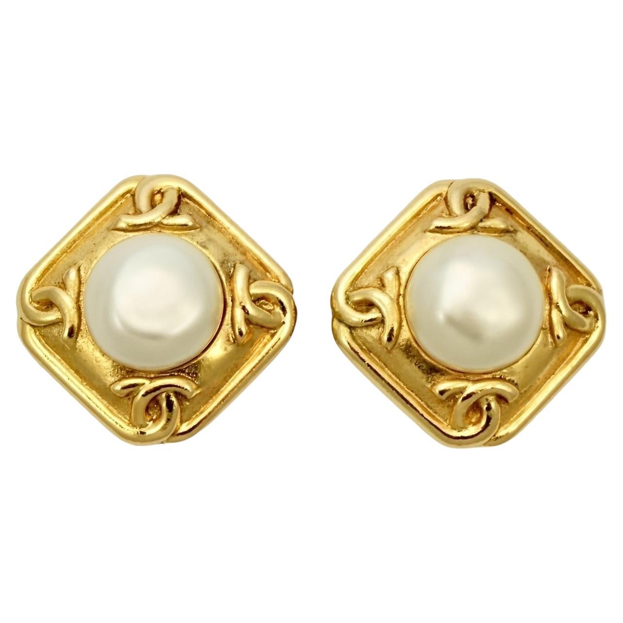 Chanel Gold Plated Logo Faux Pearl Clip On Earrings circa 1980s.