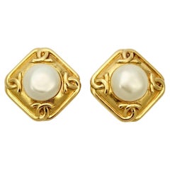 Chanel Gold Plated Logo Faux Pearl Clip On Earrings circa 1980s.