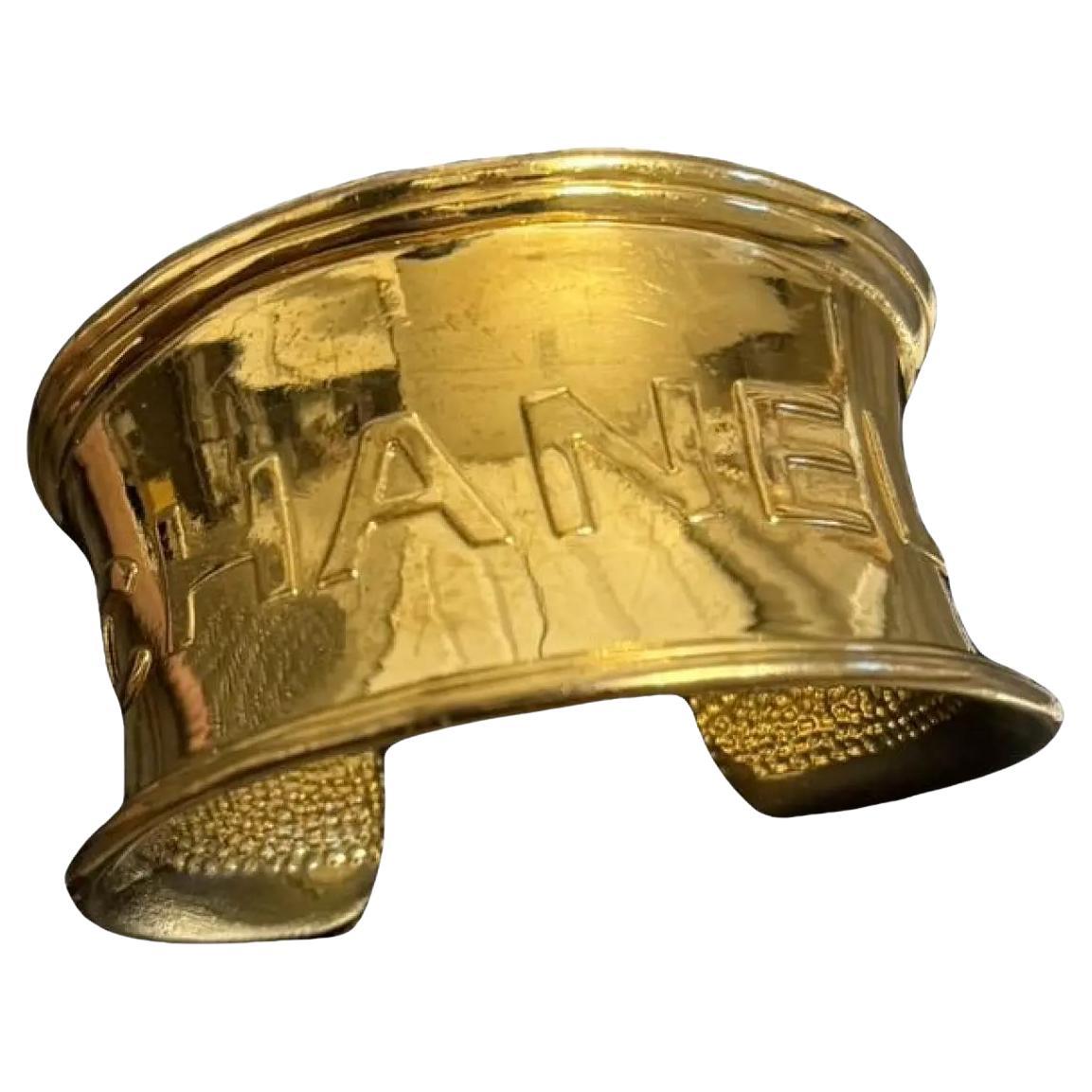 Chanel Gold Plated Vintage Logo Cuff Bracelet For Sale