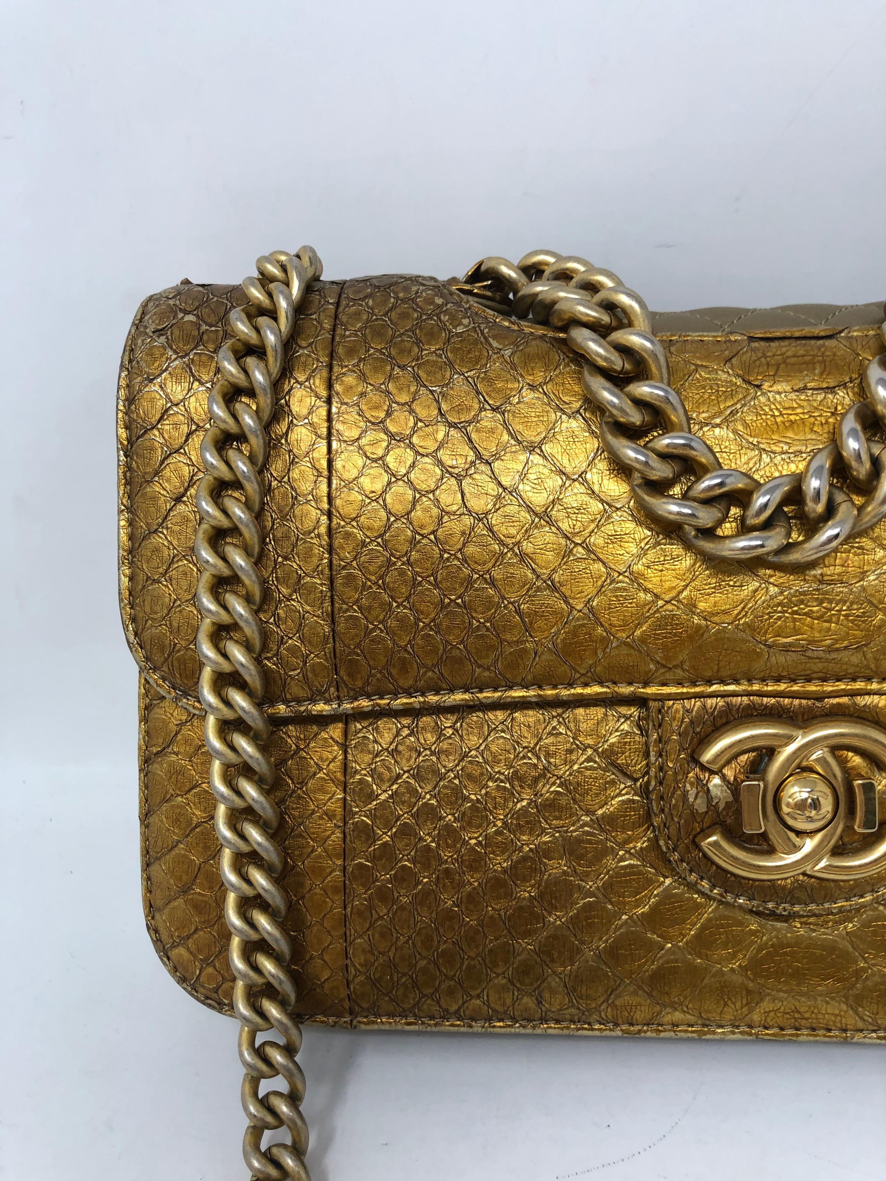 Chanel Gold Metallic Python Flap Bag. Gorgeous gold python leather with gold hardware. Exotic leather. Excellent condition. One slight wear next to clasp. Please check all photos. Stunning bag. Client hardly ever used. Original tag included.
