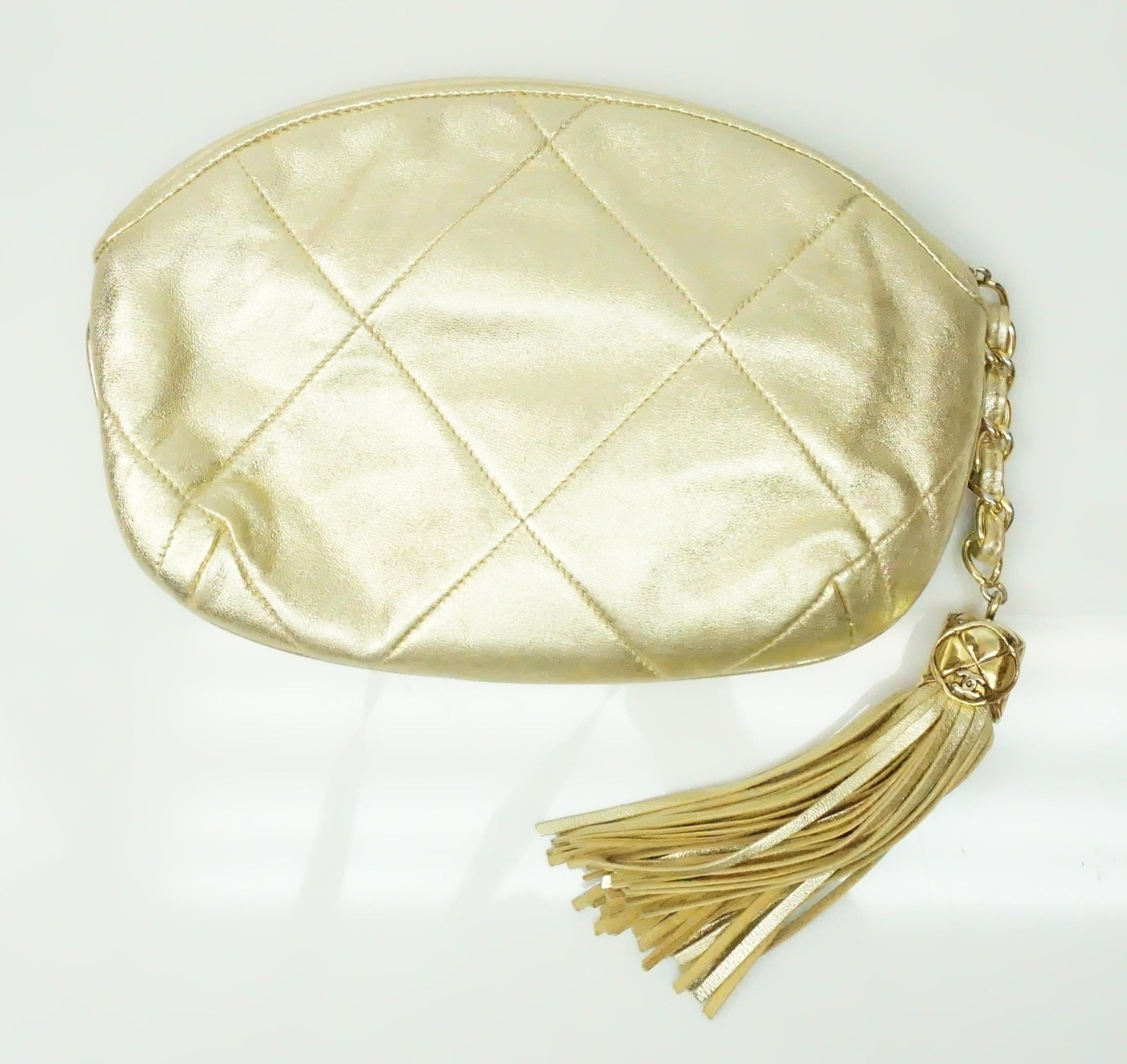Chanel Gold Quilted Evening Clutch w/ Tassel- Circa 89. This beautiful vintage Chanel evening clutch is in great condition. It shows barely any sign of use except slight tarnishing of the zipper.  It is gold colored throughout and is made of soft
