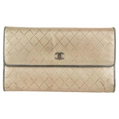 Portefeuille CC 10CC929 en cuir matelassé doré Chanel