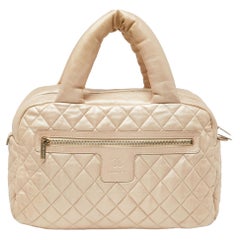 Chanel Gold gesteppte Coco Cocoon Bowlertasche aus Leder