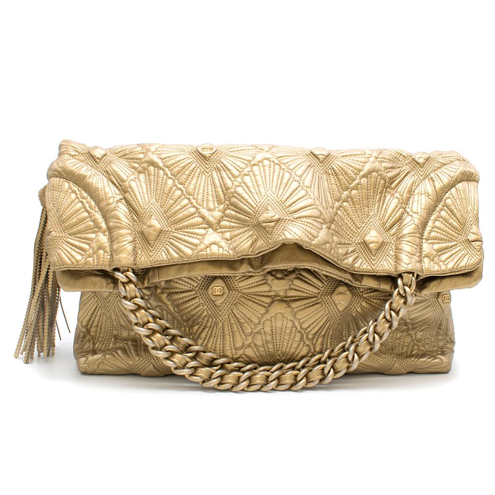 Chanel Gold Quilted Shopping Tote

- Quilted gold leather
- Gold-tone interwoven chain
- 2 main large compartments with a zipped central compartment 
- Flat zipped pocket

Item authenticated by HEWI London 

This item can be viewed in the HEWI