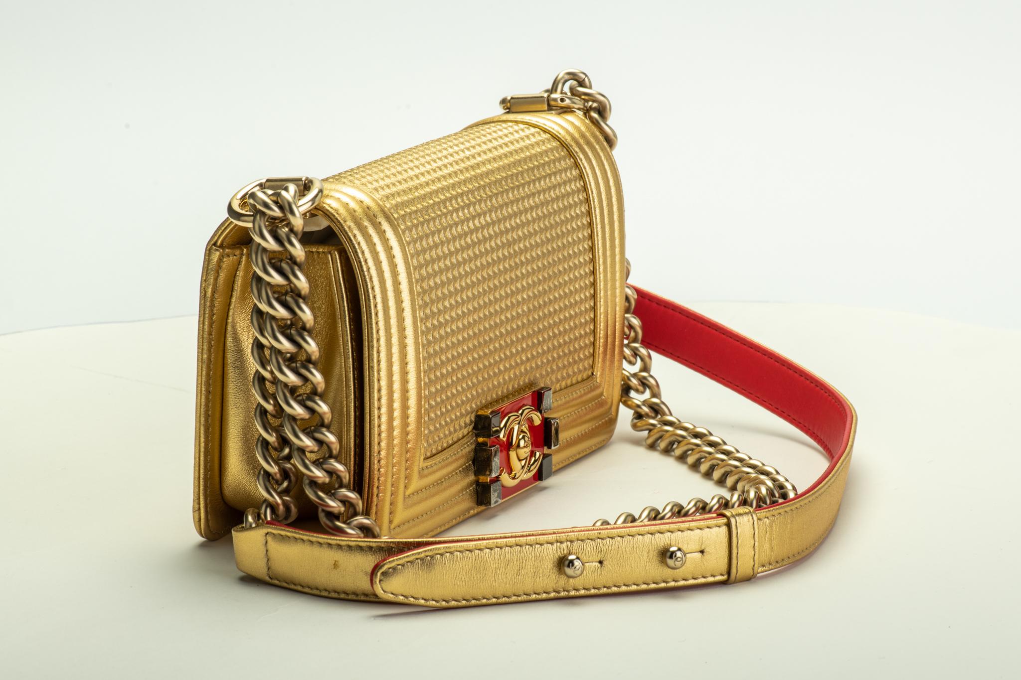 Chanel mint condition small gold boy bag with red details. Shoulder drop, 11