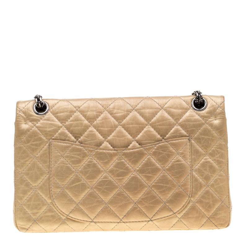 Chanel's Flap Bags are iconic and monumental in the history of fashion. This Reissue 2.55 Classic 226 is a buy that is worth every bit of your splurge. Exquisitely crafted from gold leather, it bears their signature quilt pattern and the iconic