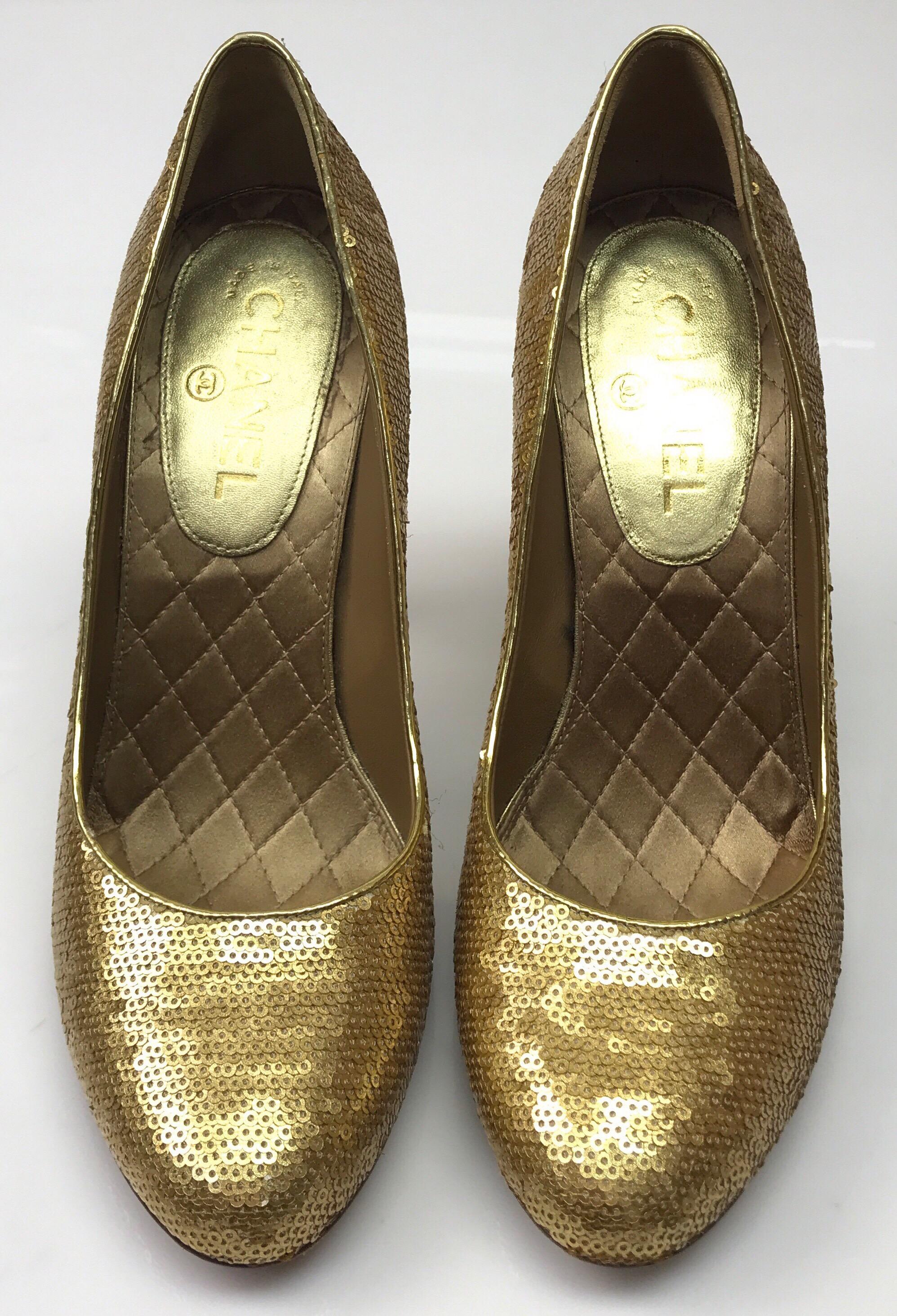 CHANEL Gold Silk Podesua Sequined Pumps - 40. These darling Chanel pumps are in good condition. They are missing a few sequins in two places, as shown in picture. The shoes are made entirely of gold sequins and have a gold silk heel with a gold 