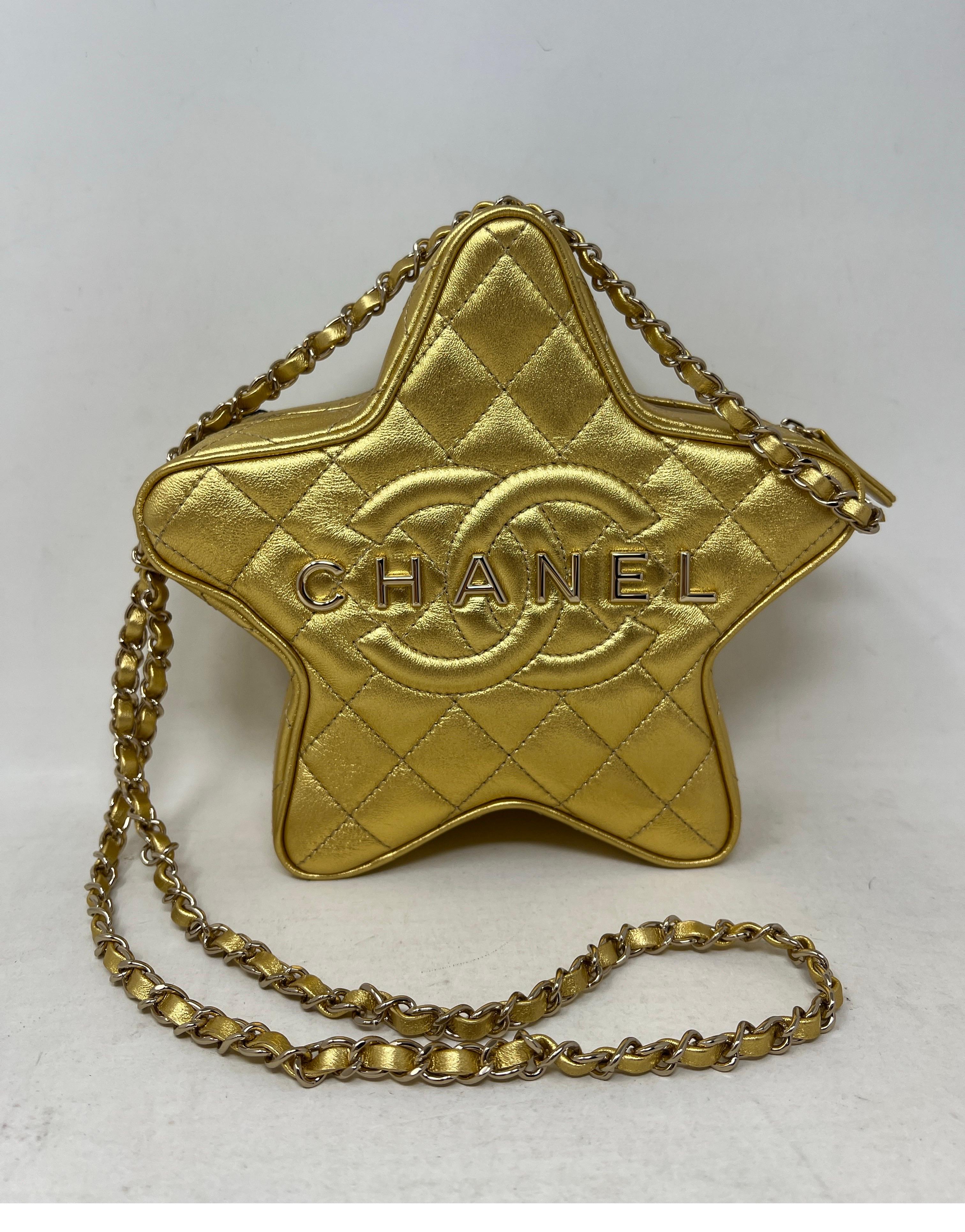 Chanel Gold Star Bag. Excellent like new condition. Gold hardware. Gold metallic leather star is limited edition. Collector's piece. Full set. Includes dust bag and box. Original tags included too. Guaranteed authentic. 