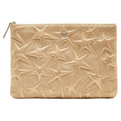 Chanel Gold Star Embossed Leather O Case Medium Quilted Boy Clutch Bag