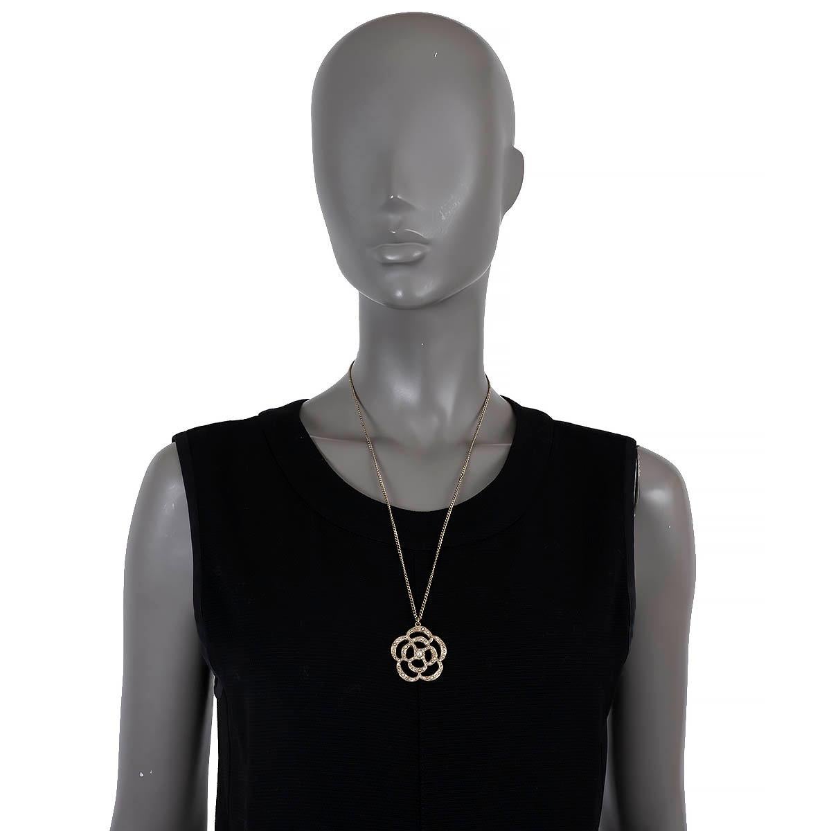 100% authentic Chanel chain necklace in gold-tone metal with crystal and faux pearl encrusted Camellia pendant. Has been worn and is in excellent condition. 

2014 Continuous Collection

Measurements
Model	14V
Width	3.4cm (1.3in)
Height	3.5cm