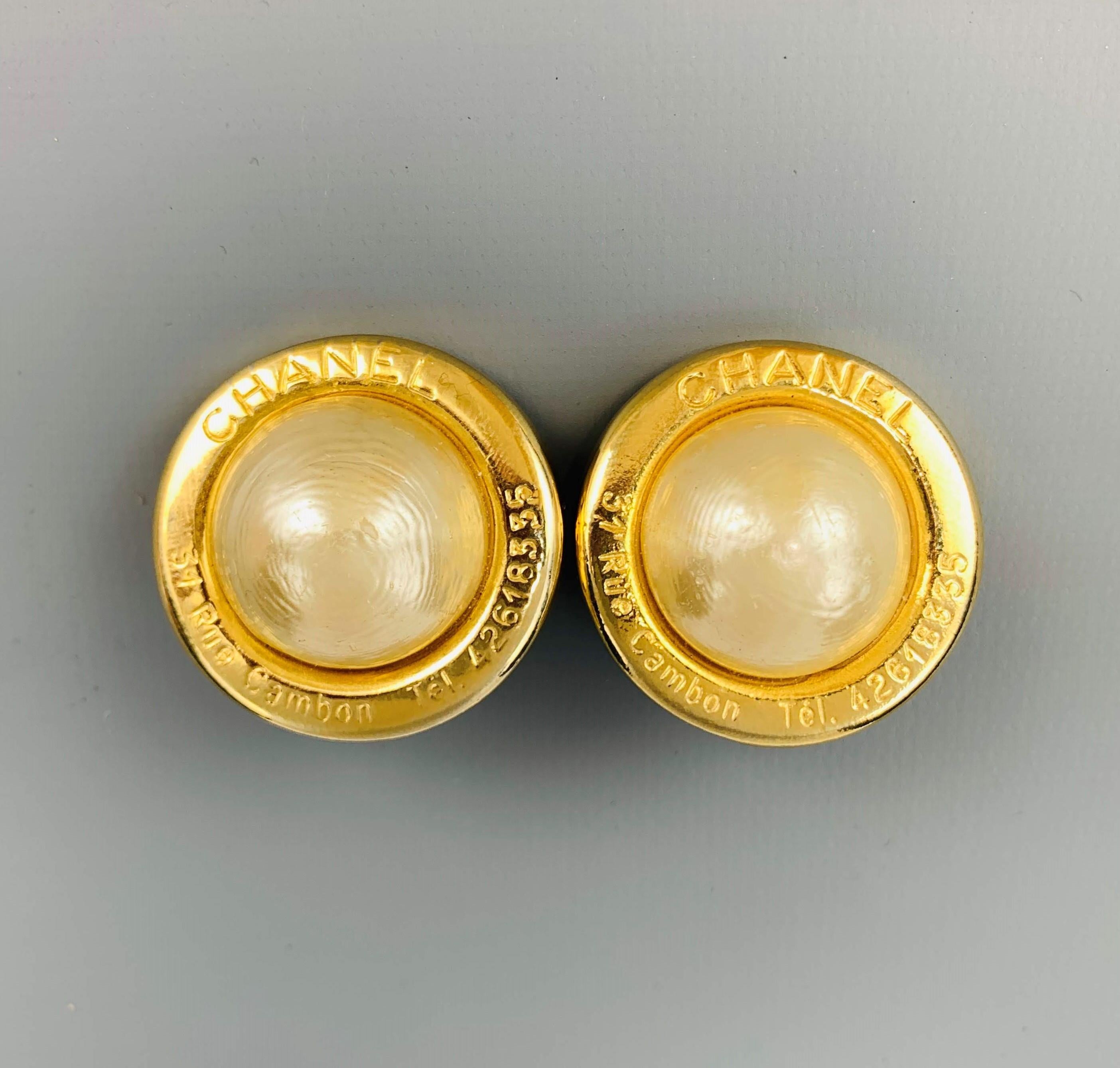 Vintage CHANEL (Circa 1954-1971) round clip on earrings come in yellow gold tone metal with 