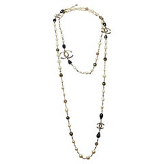Chanel Gold Tone Black Enamel Crystal CC Charm Necklace