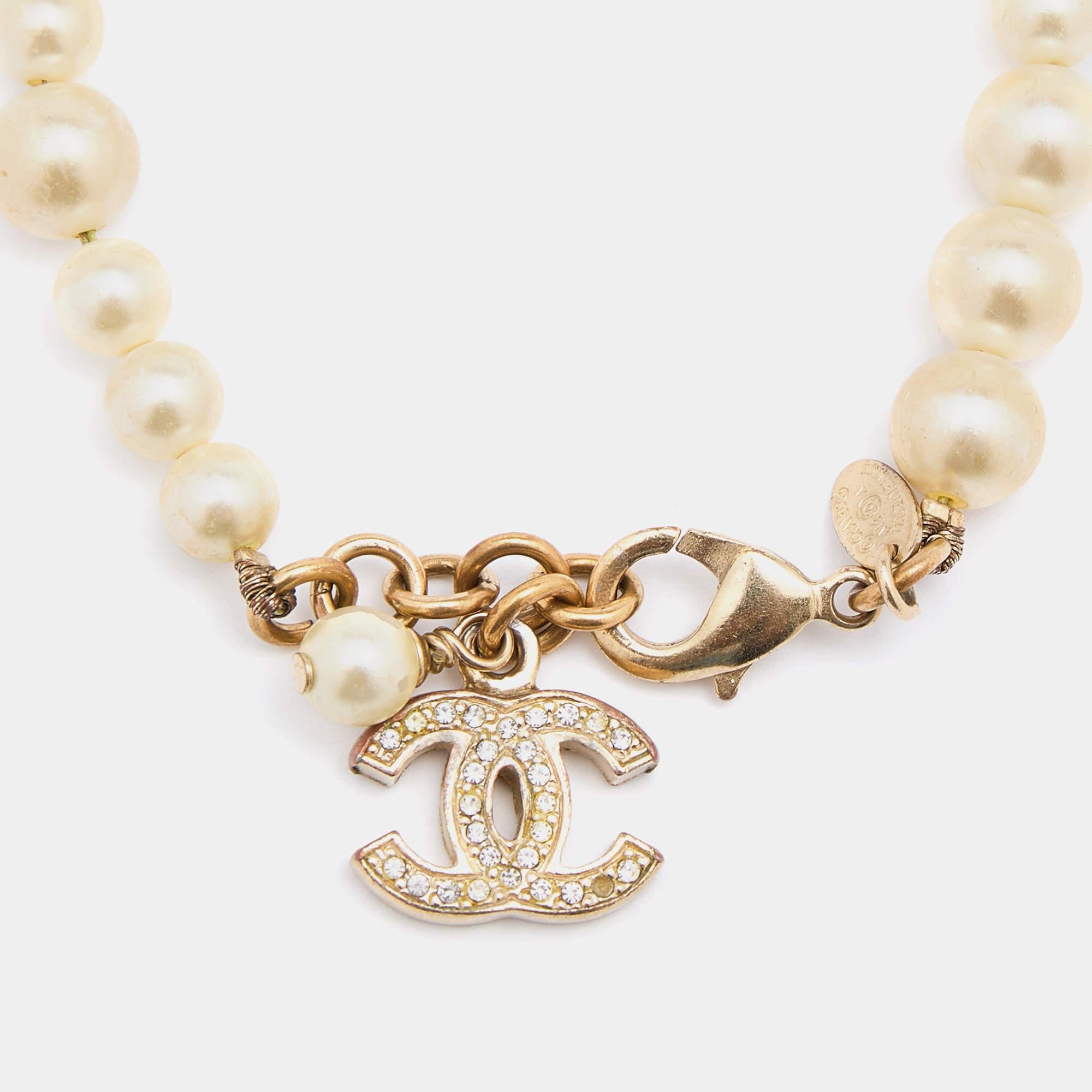 Chanel Gold Tone CC Charm Faux Pearl Bracelet In Fair Condition In Dubai, Al Qouz 2