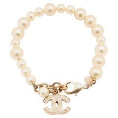 Chanel Gold Tone CC Charm Faux Pearl Bracelet
