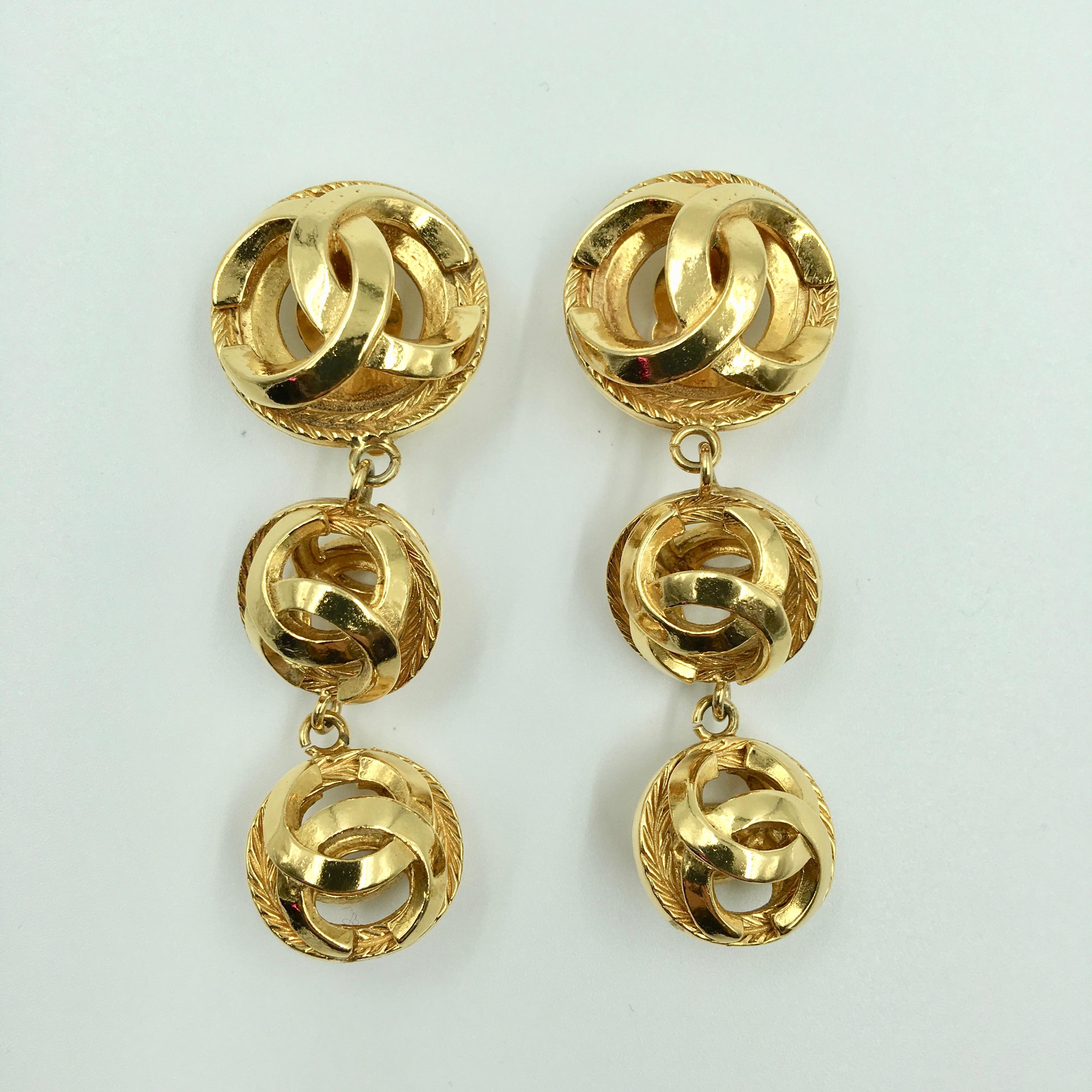 Contemporary Chanel Gold Tone CC Logo Drop Clip On Earrings