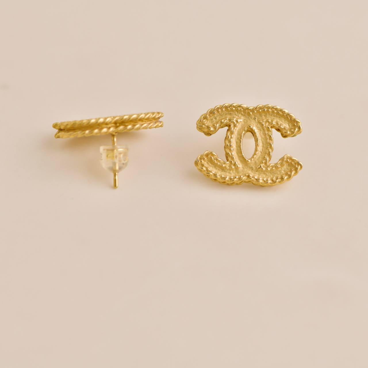 Women's or Men's Chanel Gold Tone CC Stud Earrings For Sale