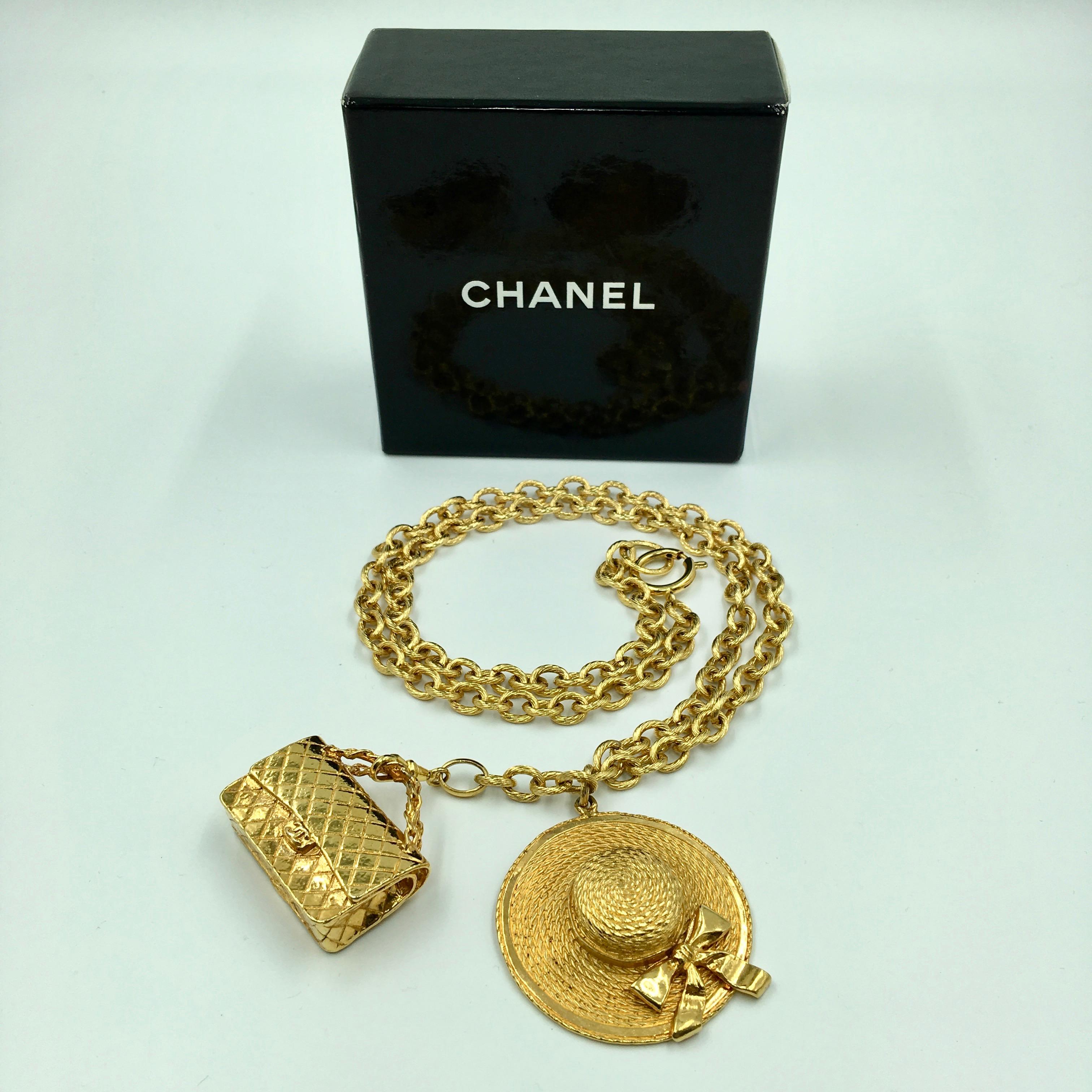 Chanel Gold Tone Classic Coco Chanel Chapeau and Quilted Handbag Charm Necklace. Stamped Chanel and Made In France. No scratches, nicks, discoloring.
Very good vintage condition. 

Measurements are as follows:

Necklace chain, from back neck drop -