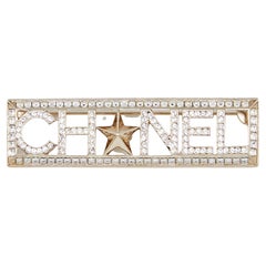 Chanel Gold Tone Crystal Star Logo Pin Brooch