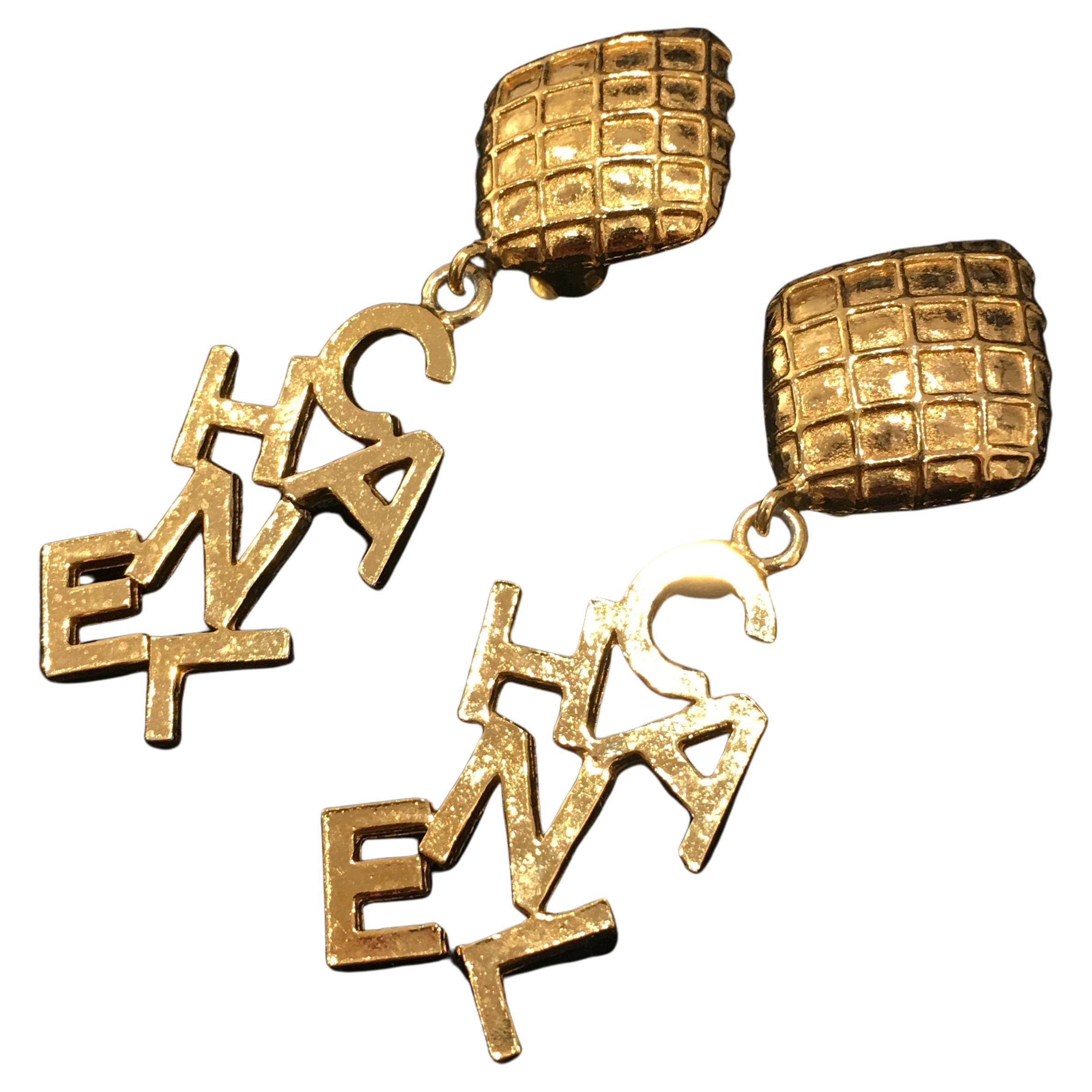 Chanel Gold Tone Diamond Quilt Shape Dangle C-H-A-N-E-L Clip Earrings, 1980's