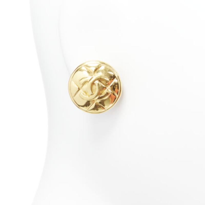 Women's CHANEL gold tone diamond quilted CC logo medallion coin clip on earring