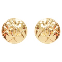 Used CHANEL gold tone diamond quilted CC logo medallion coin clip on earring