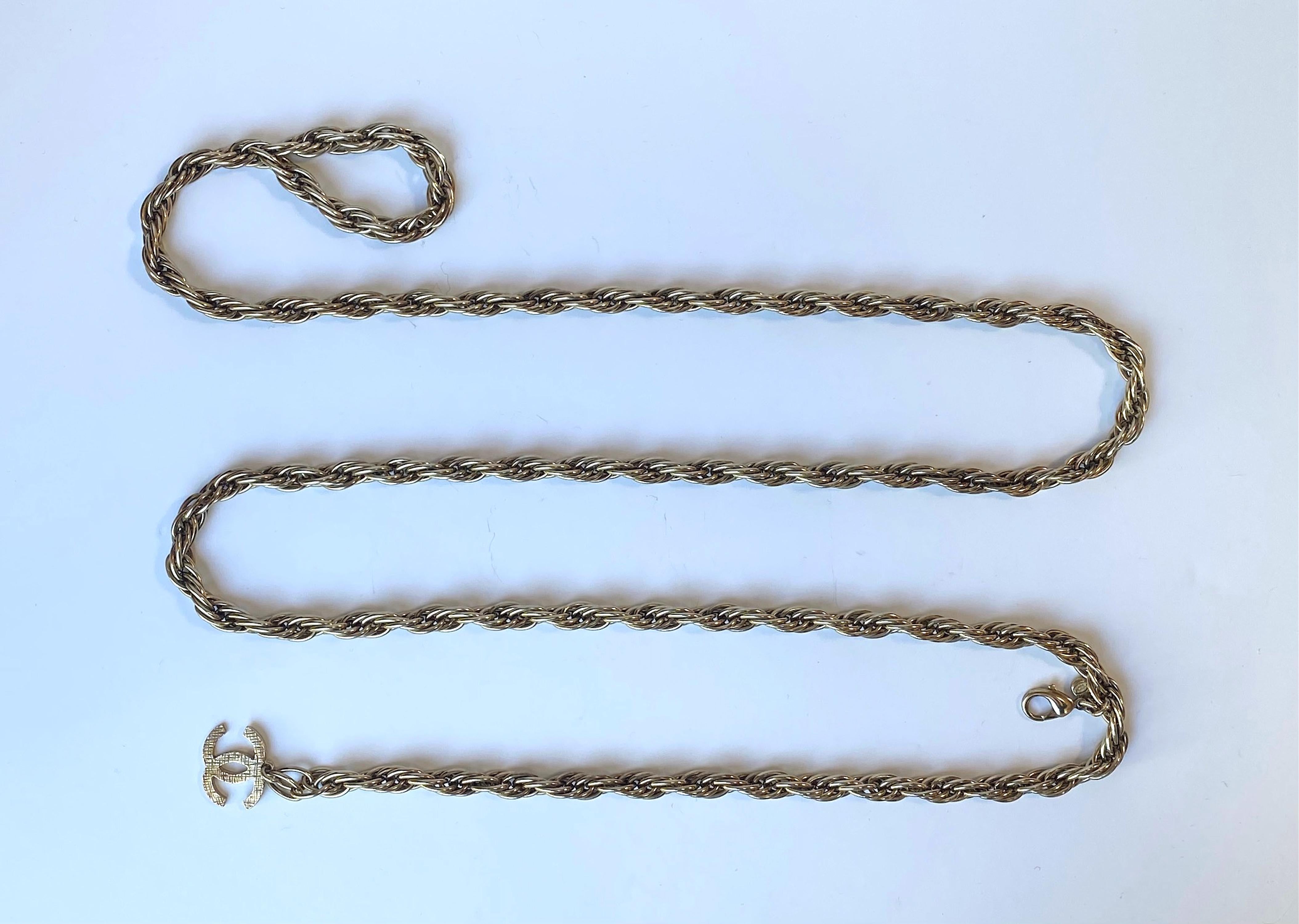 A very nice and classic Chanel rope style chain belt from the Autumn 2006 collection. The chain is 3/8 of an inch in diameter and has a 1 inch wide and .75 of an inch tall Chanel CC logo charm on one end. The is large lobster claw clasp attach at