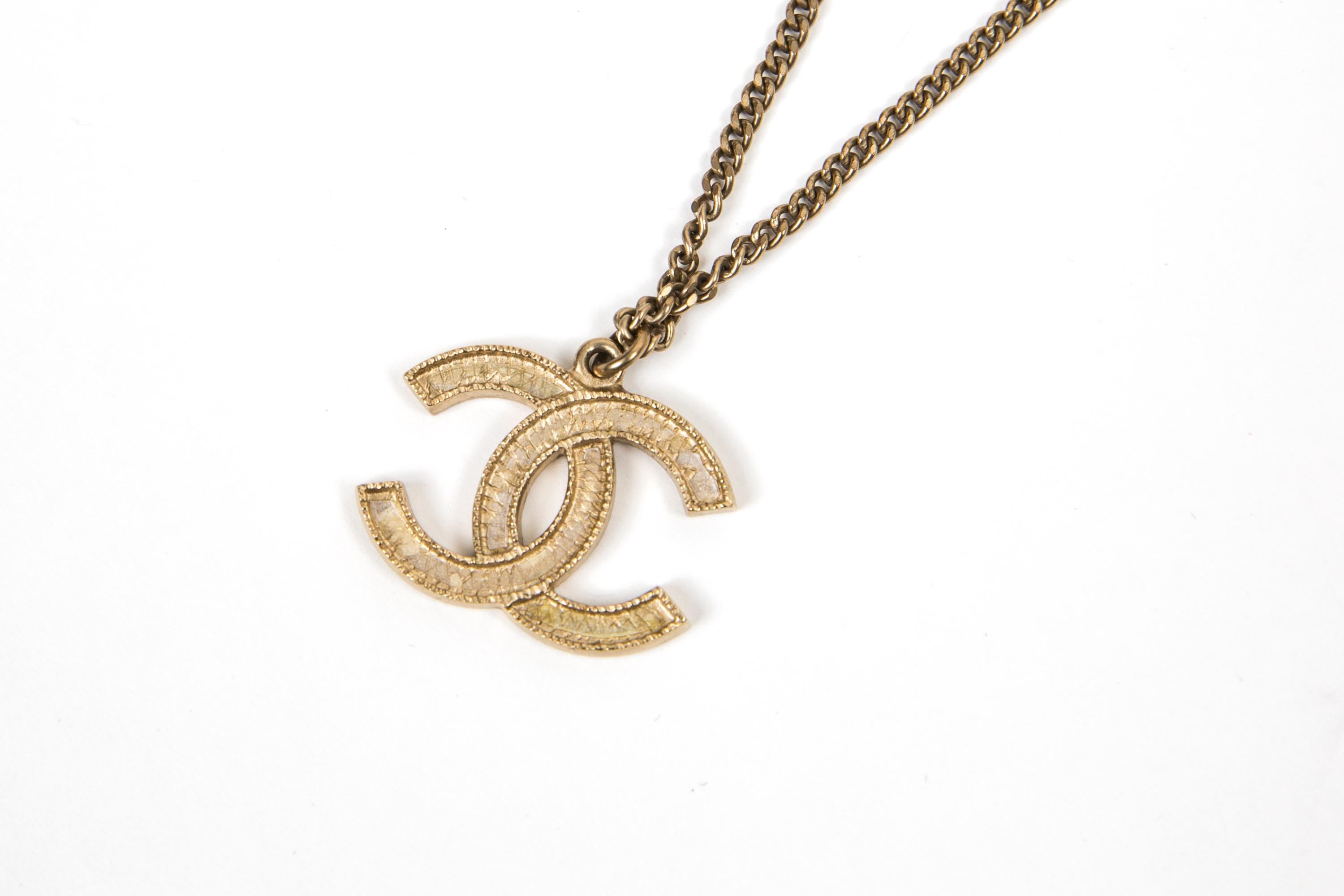 Chanel Gold Tone Logo Pendant Necklace In Good Condition For Sale In Paris, FR
