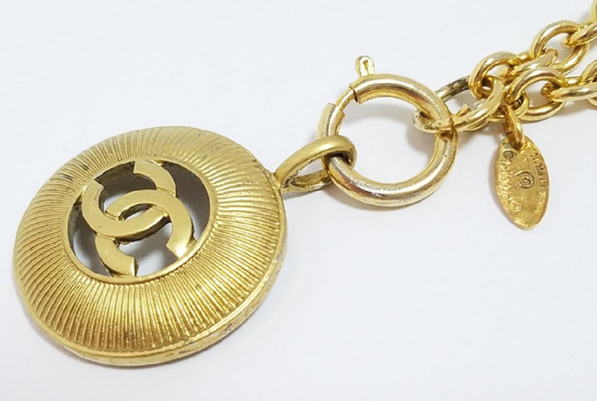 Women's Chanel Gold-tone Metal CC Logo Cutout Sunburst Pendant Necklace